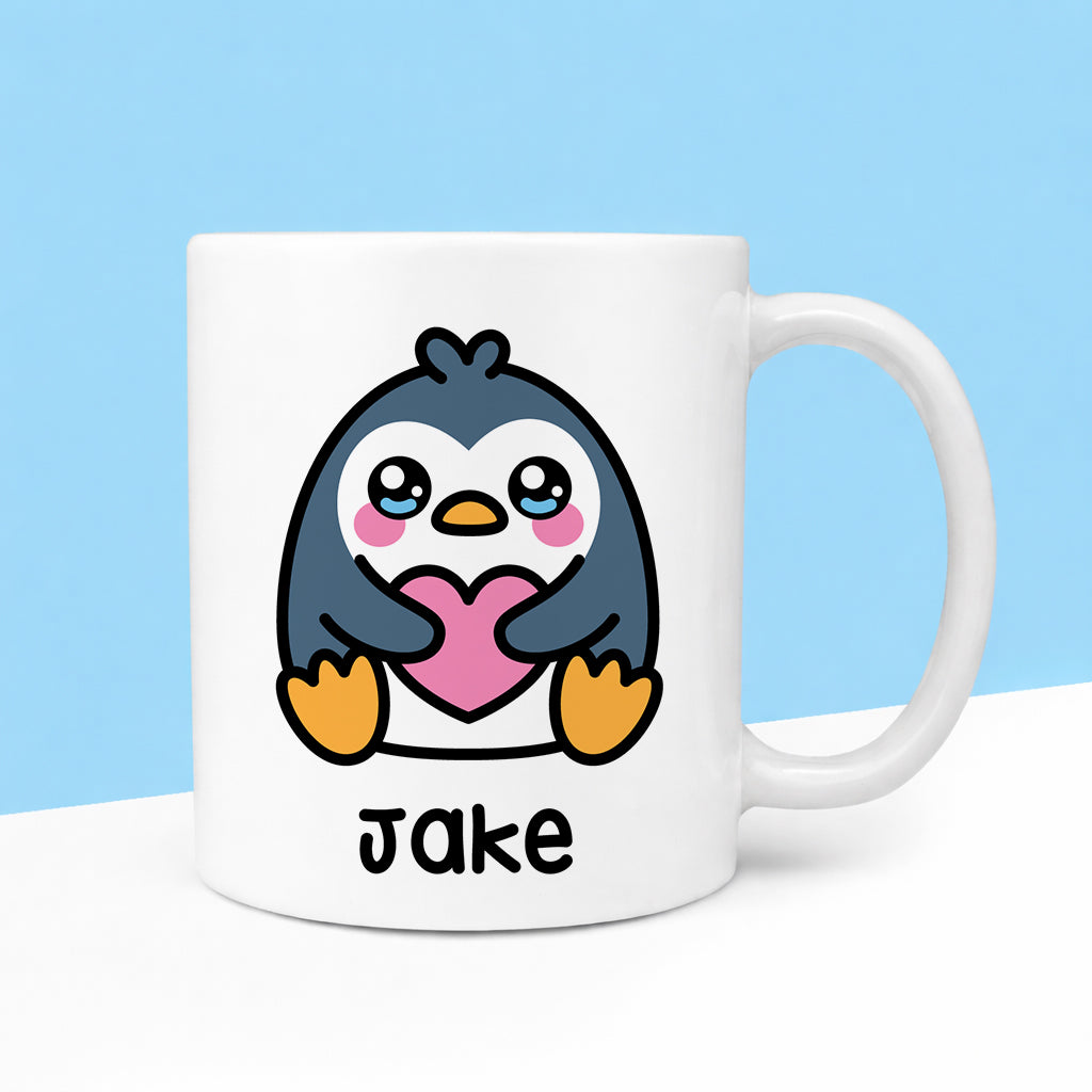 Mug with a cartoon penguin holding a heart