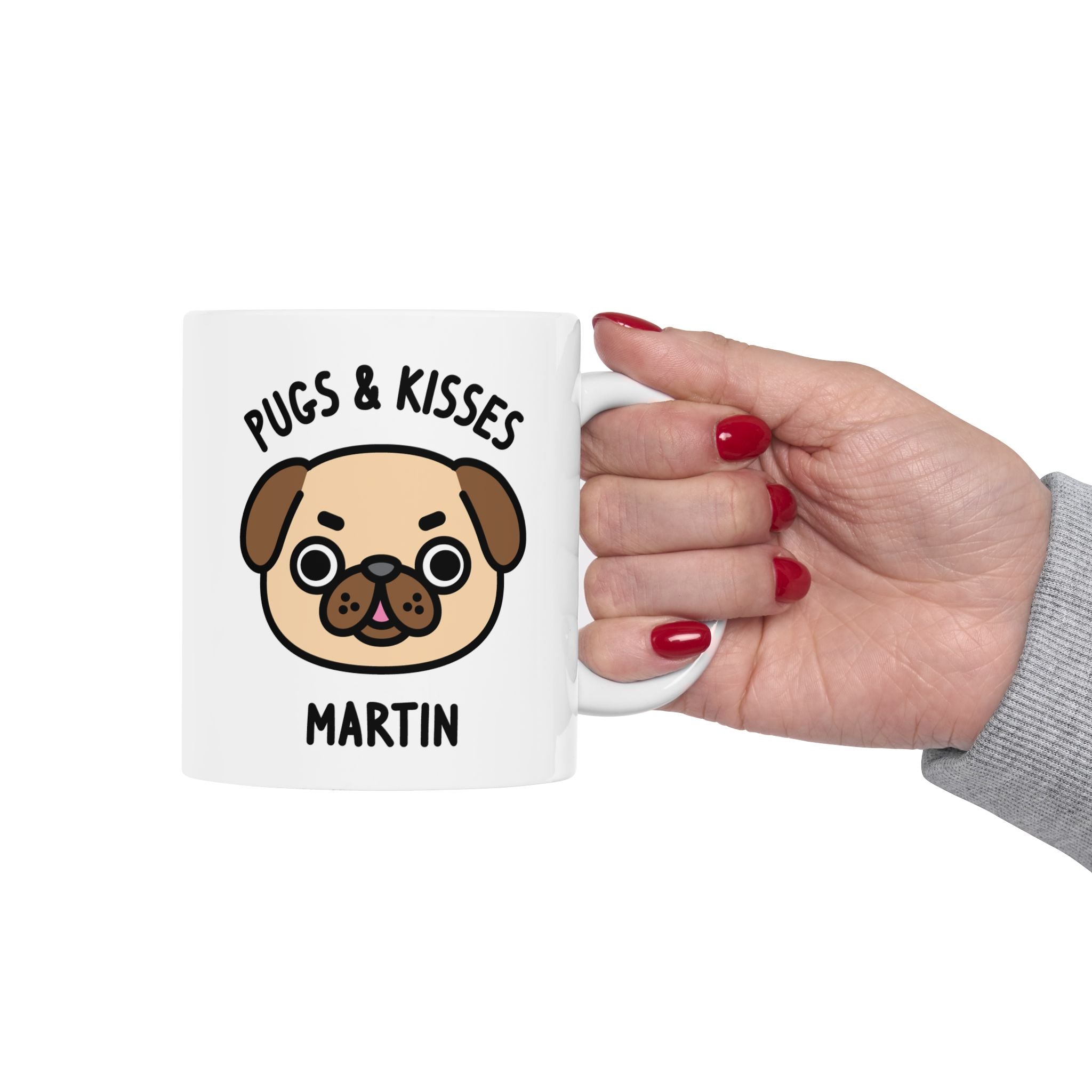 a white coffee mug with a pug dog illustration held by hand on white background
