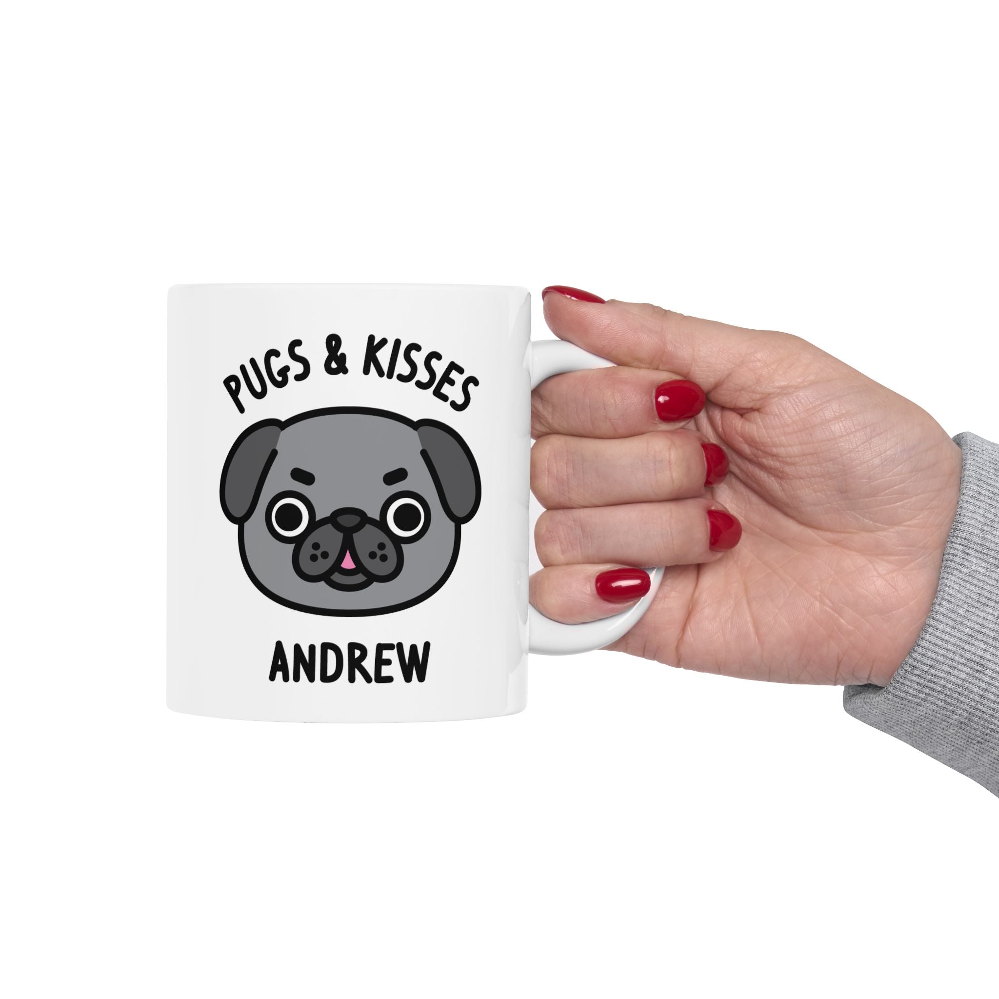 a white coffee mug with a pug dog illustration held by hand on white background