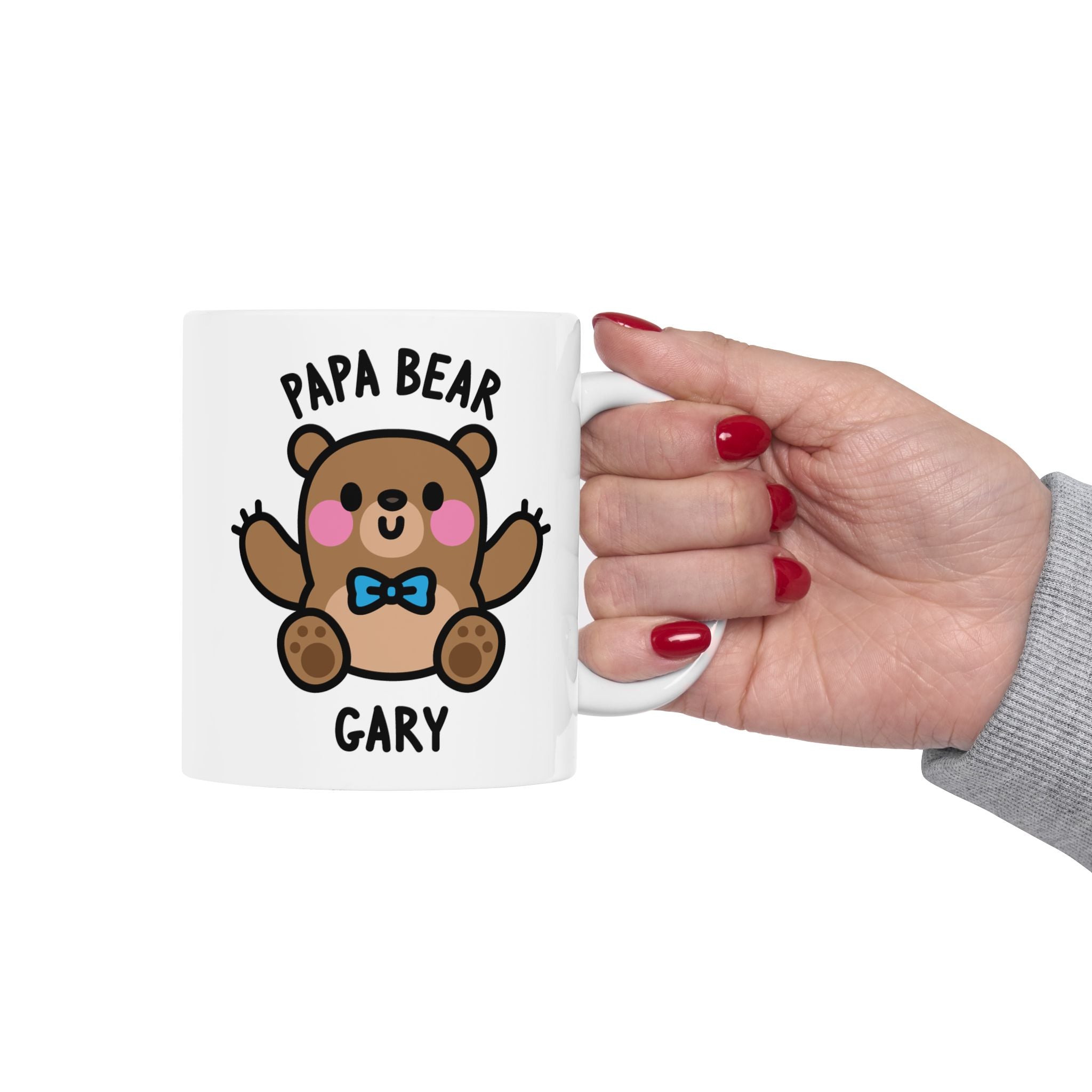 Mug with 'Papa Bear' design held by a hand with red nail polish on a white background